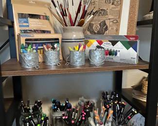Art supplies: paint pens, brushes, paints