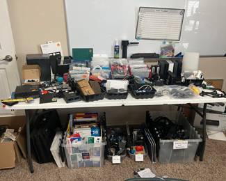 printer paper, media cables, usb ports, tech tool kits, bose speaker, routers, charging banks, external hard drives white board, shredder