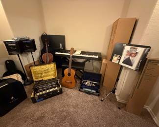 Musical instruments, sound speakers on tripods, sheet music