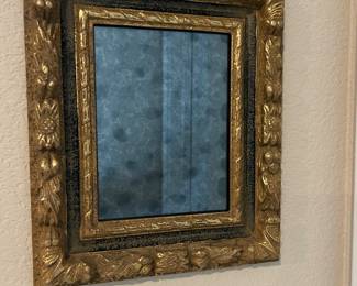Framed gilded mirror