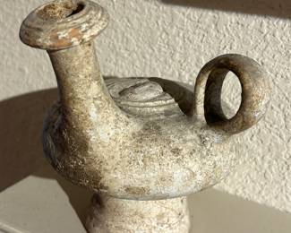Roman clay oil jar, face image embossed