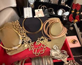 Silver bangles, gold necklaces (costume), earrings 