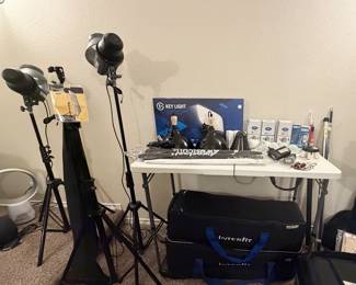 Photography lighting equipment - carrying cases (under table), light bulbs, LED panels