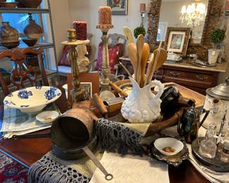Antique copper saucepans, European linens, table runners