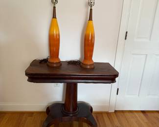Mid Century Orange and Yellow Pottery Lamps (Pair)            sitting on a Circa 1890"s Carved Mahogany Folding Gaming Table on Casters