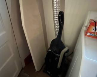 Ironing board; vacuum