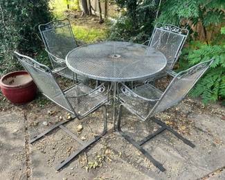 Metal Outdoor Patio Set
Good condition. 
Some very minor rust spots, nothing rusted through.
Table measures: 42” across x 28” tall 
Chairs measure: 27” across x 17” deep x 16” tall to seat, 37” tall to back
Must be able to move and load yourself
