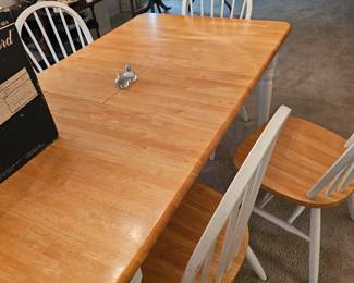 Farmhouse-style dining table.  6 chairs, leaf folds under table.