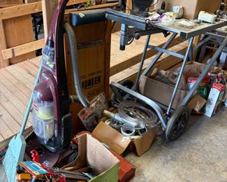 Grilling supplies, creeper, vacuum cleaner, tool table