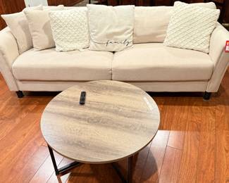 Cream White Sofa with Pillows. Shown with 36" Round Coffee Table