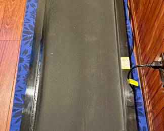 Rhythm Fun Walking Pad used with Standing Desks where a Treadmill is not capable in small space with Remote Control.