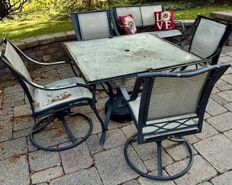Aluminum cast square outdoor dining table with 4 Swivel Rockers and Umbrella (Not Pictured)