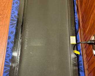 Rhythm Fun Walking Pad used with Standing Desks where a Treadmill is not capable in small space with Remote Control.