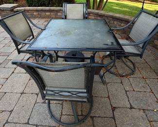 Aluminum cast square outdoor dining table with 4 Swivel Rockers and Umbrella (Not Pictured)