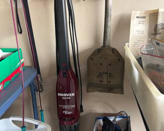 Hoover Sprint light weight vaccuum cleaner, Military shovel on right. bungy cords,