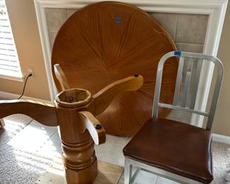 Solid Oak round table (about 70" diameter) with pedestal base. Has so scratches on top. Paint the base black and it'll look great!