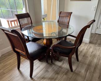 Round dining table 48" Glass top, 2 arm chairs, 2 side chairs $275