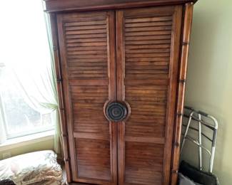 Cindy Crawford Armoire 2 door can be a wardrobe complete with rod for clothing or a TV can fit nicely inside. The doors open wide for a TV with nice hinges. It has 6 drawers for storage and shelving as well that can be used or removed. $300