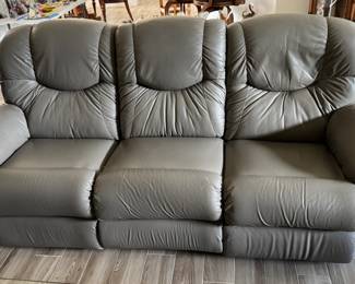Leather sofa with 2 manual recliners 40 1/2" tall, 88" wide, 1 white mark shown in photo $600, matching recliner not shown $250