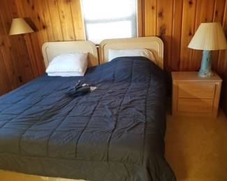 Twin beds; two drawer nightstand; table lamp