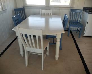Dining table seats 6; extra table leaf available but not shown