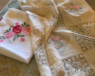 pretty tablecloths and crosstitched linens