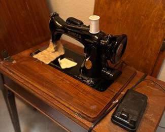 Vintage sewing machine and cabinet