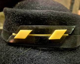 Vintage bakelite pin with hat