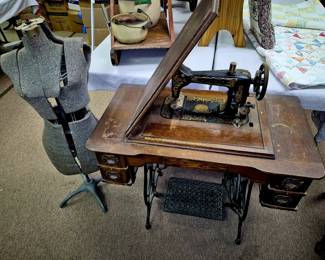 Antique Damascus treadle sewing machine and vintage dress form