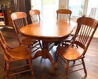 solid wood oval dining table with one leaf, 6 chairs