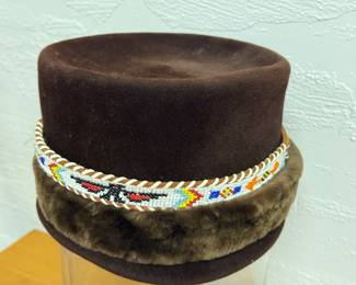 Fun fur mix up of felt hat with mutton rim and little western belt turned hat band