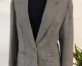 Well constructed wool jacket with nice black tshirt and fashion necklace