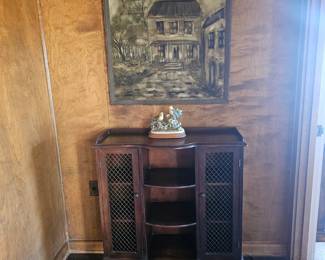 Display cabinet with art