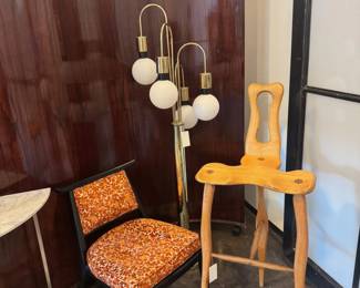 There are 2 of the orange chairs. There are also 2 waterfall lamps. One lamp is more of a floor lamp and one is more of a table lamp.