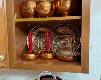 Copper plates, bowls, and candle holders
