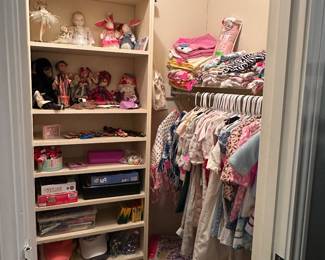 Closet full of children's clothing, dolls, etc.