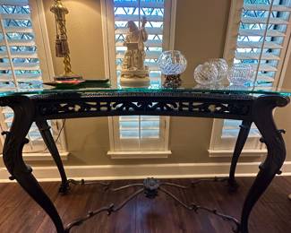 Elegant console table with scrolled legs and a beveled glass top