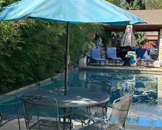 Metal table and 4 chairs with umbrella