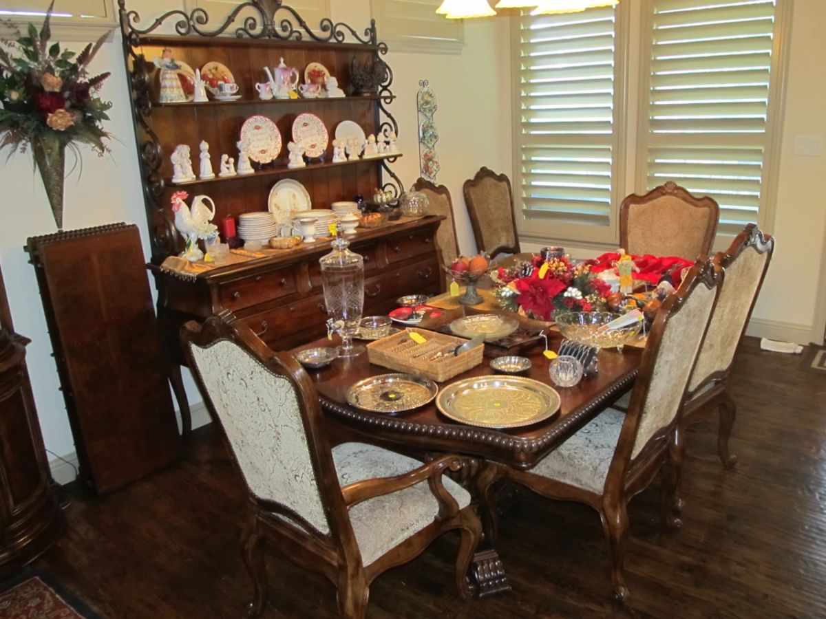 Elegant dining table by Universal Furniture with substantial 6 upholstered dining chairs and 3 leaves. Lovely open "baker's rack style" 2-piece hutch