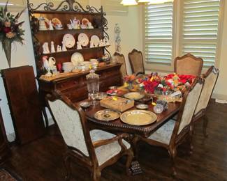 Elegant dining table by Universal Furniture with substantial 6 upholstered dining chairs and 3 leaves. Lovely open "baker's rack style" 2-piece hutch