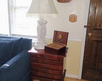 This beautiful cherub lamp, humidor, and flatware storage chest. Also the clock chimes