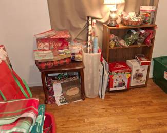 Christmas items including ornaments, linen, decorative pieces, wrapping paper, lights, garland, and trees.