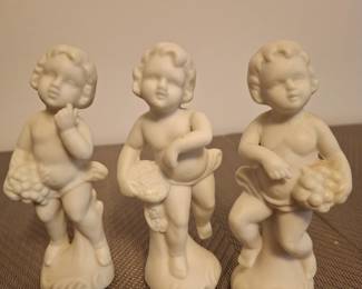 Set of 3 - 3 1/2" porcelain figurines.  $20