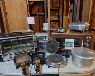 Several Vintage Appliances by Toastmaster, Sunbeam, Presto and vintage table.