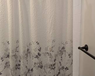 Brand new never used shower curtain and rings. We renovated this bathroom, and the shower has never been used since purchased. 