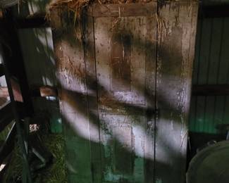 Primitive cabinet in barn