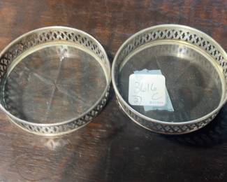 Two Sterling Rimmed Glass Bottom Coasters