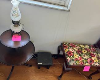Double round table, lamp, stool, and small floral bench