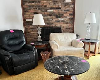 round table, pedestal tables, oversized chair, and Paul Hanson lamps