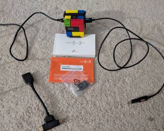 WST073 "Rubik's Cube" Smartphone Wall Projector and HDMI Accessories from SK Telecom.